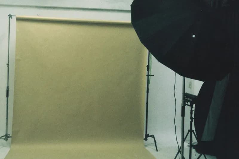 A photographer’s backdrop and lights, set up and waiting