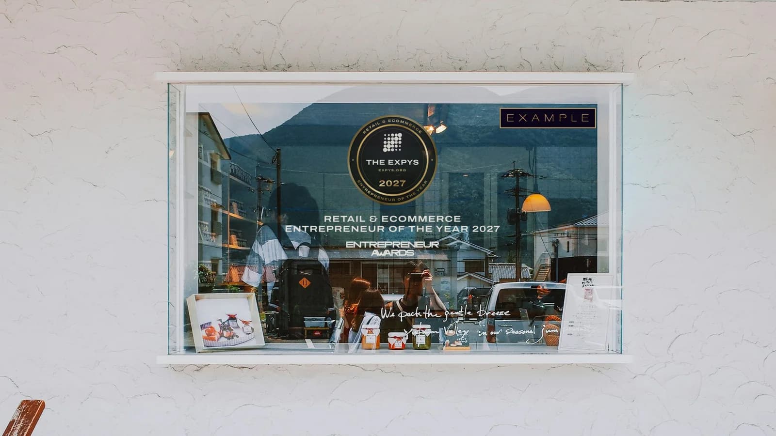 The Entrepreneur Awards winner decal on a shop window, Retail & Ecommerce Entrepreneur of the Year 2027, marked example