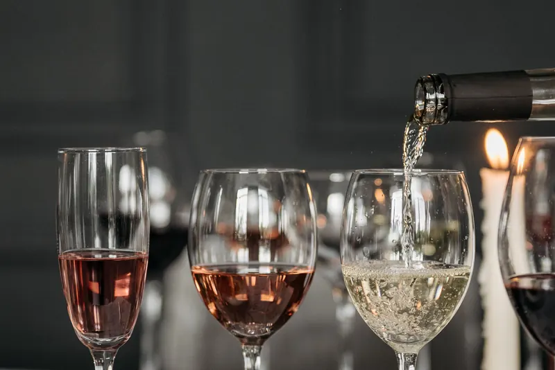 A tasting flight of wines by candlelight
