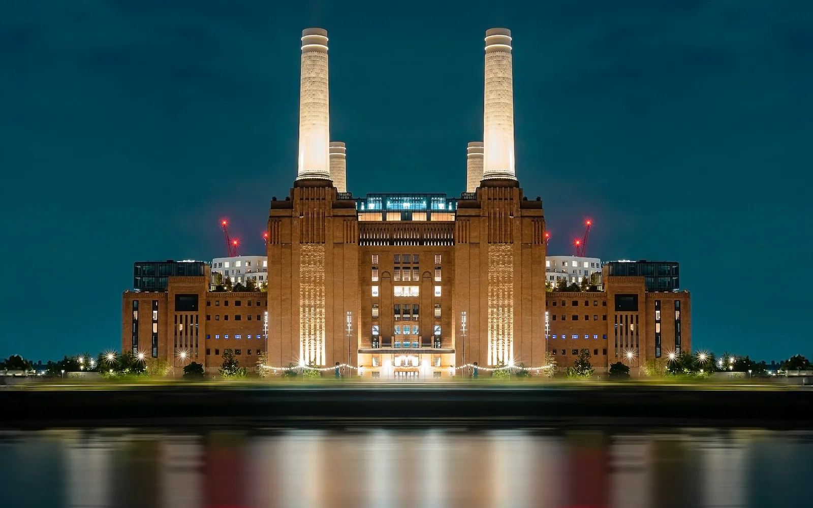 Battersea Power Station lit up at night, beside Nine Elms, London